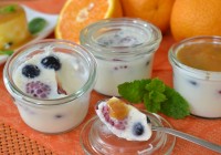 Latte cotta with raspberries and blueberries and orange sauce